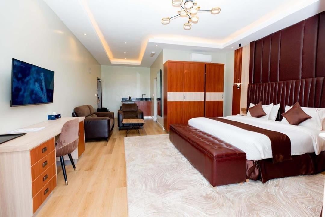 Panoramic evening view of illuminated Kigali skyline from the Penthouse